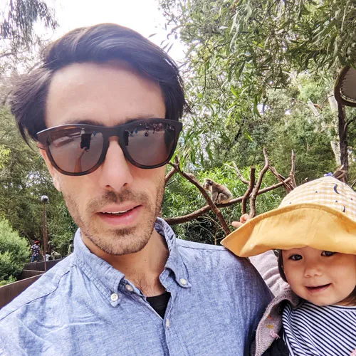 A photo of Ben with a monkey in the background